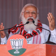India’s Prime Minister Narendra Modi gestures as he addresses a public meeting ahead of Assam Assembly elections, in Bokakhat on March 21, 2021.